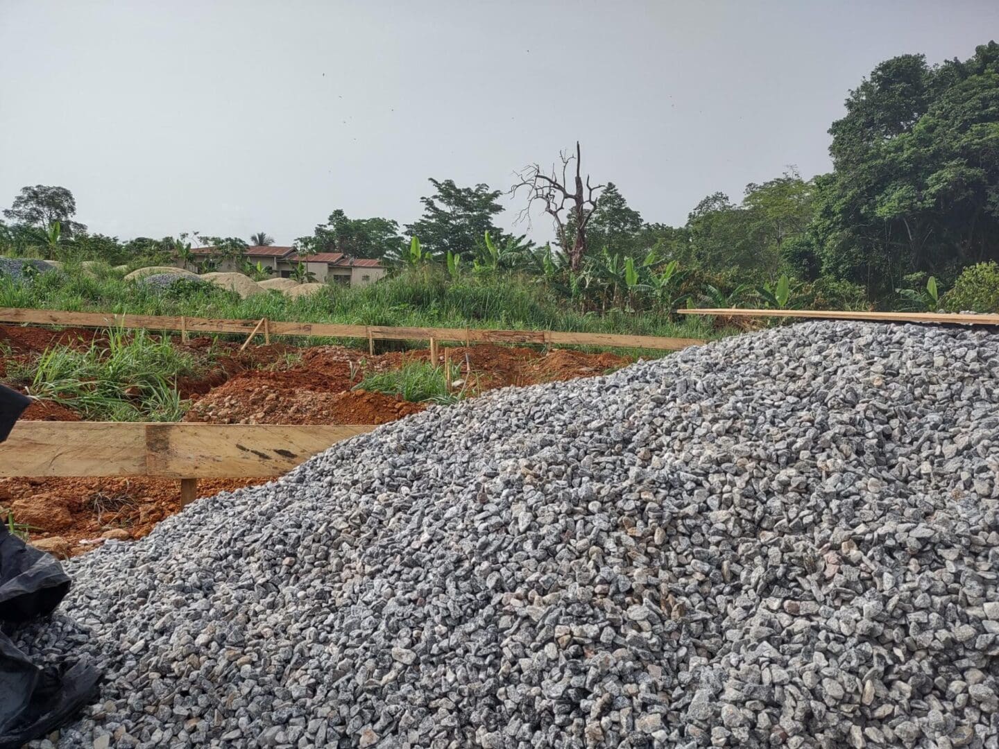 A pile of gravel on top of the ground.