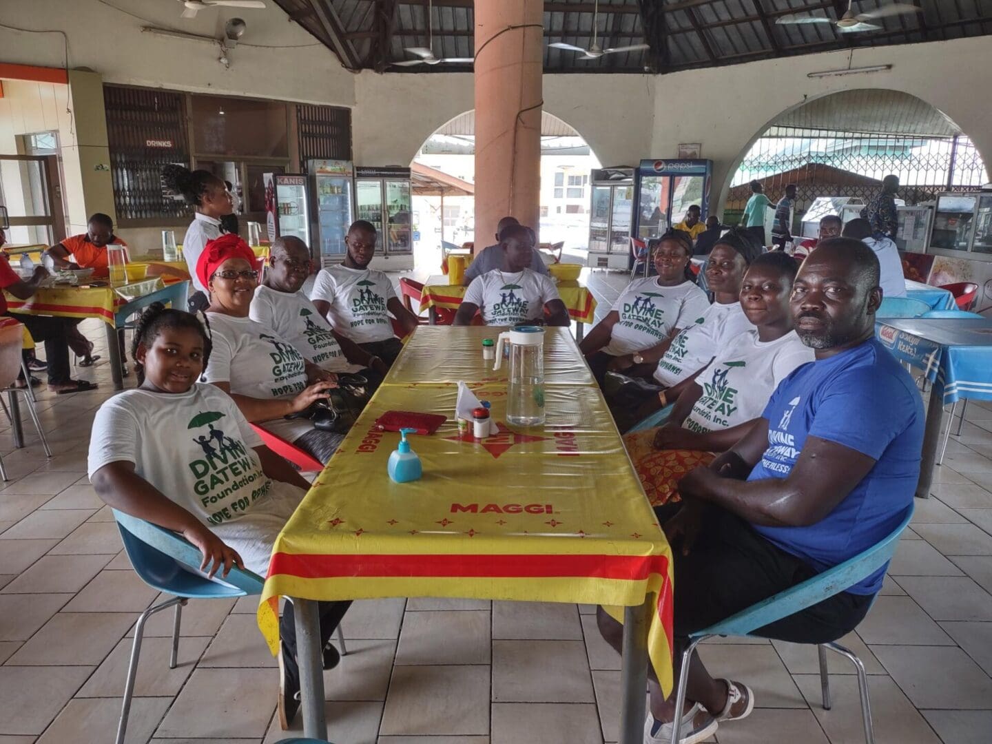 A group of people sitting around a table.