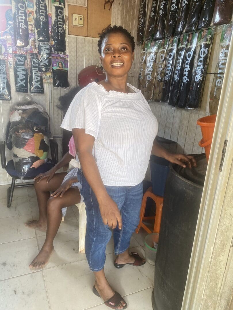 A woman standing in front of some chairs