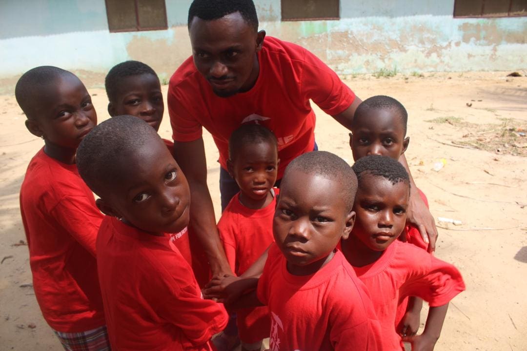 A group of young boys in red shirts.