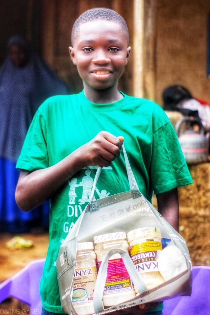 A kid holding a bag and smiling