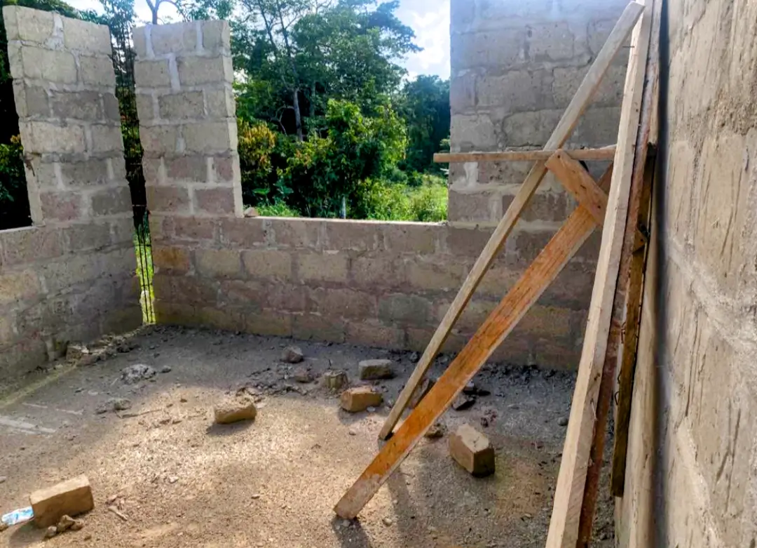 A building being built with some wood and bricks